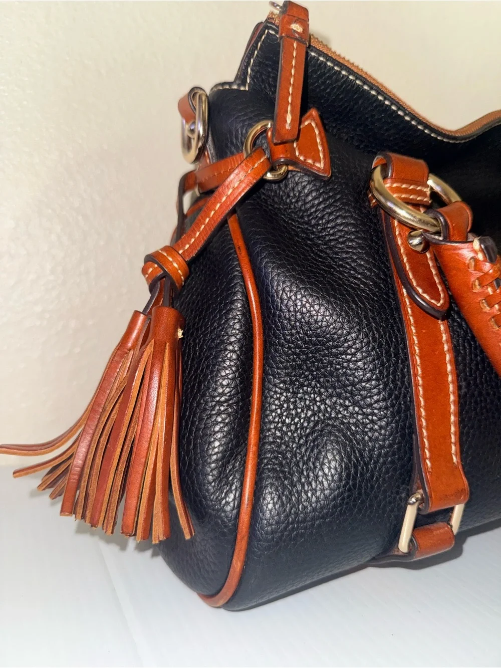 Dooney & Bourke Black with Brown Trim Pebbled Leather Satchel